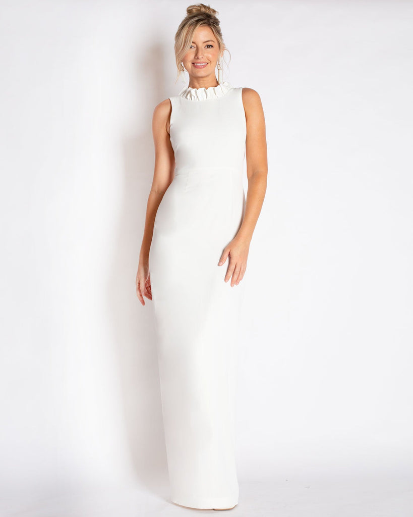 This floor length gown made in a stretch crepe material that is comfortable to wear. A sheath silhouette that is tailored, not tight.  Ruffle neckline with a v-back detail that is bra-friendly. Made in a Ivory White Color.